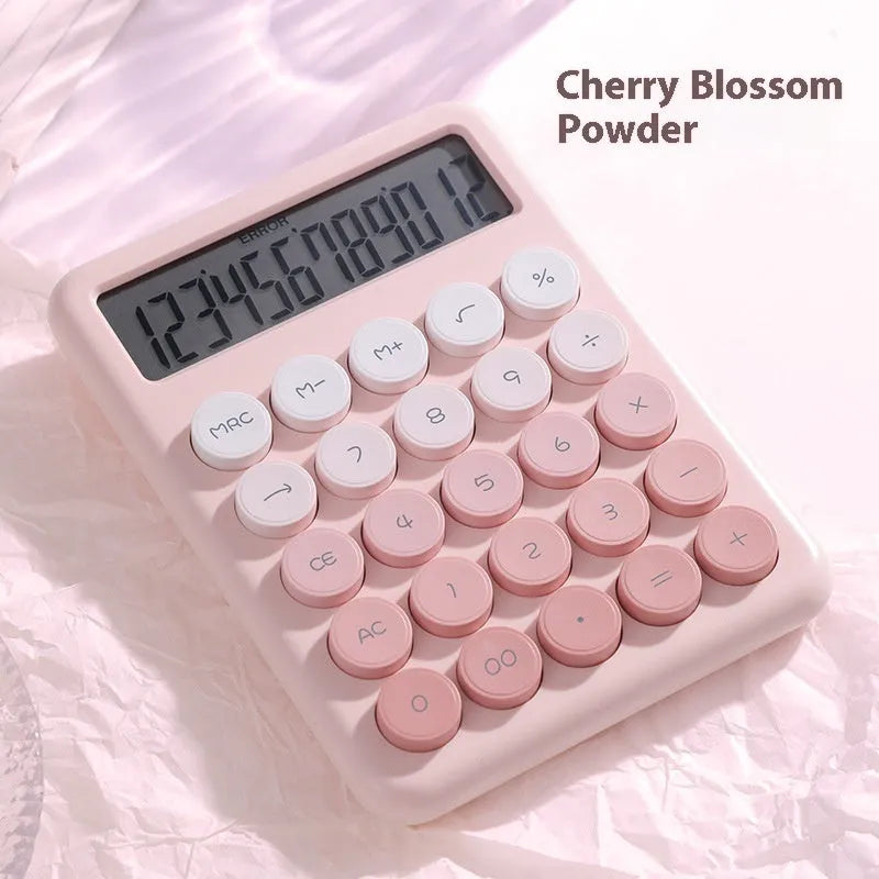 Solar-powered desktop calculator with a violet and white gradient colour design on a desk.