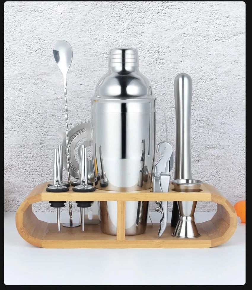 23-piece stainless steel cocktail set with acrylic mixing components on bar counter