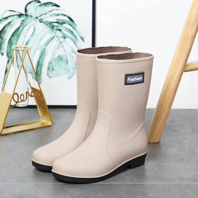 Women's mid-calf PVC rain boots in black with low heel for waterproof work footwear