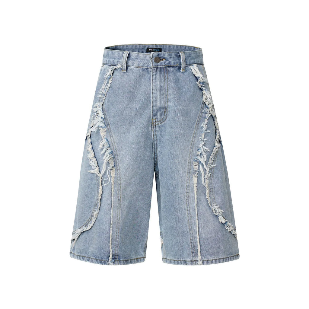 Straight cut denim shorts with raw edge distressing in black, shown on a model.