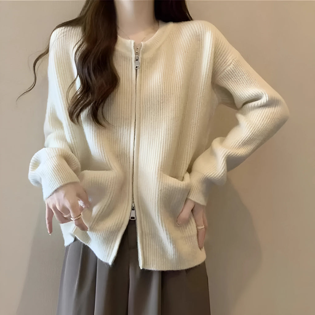 Beige viscose fibre sweater coat cardigan with long sleeves laid flat.