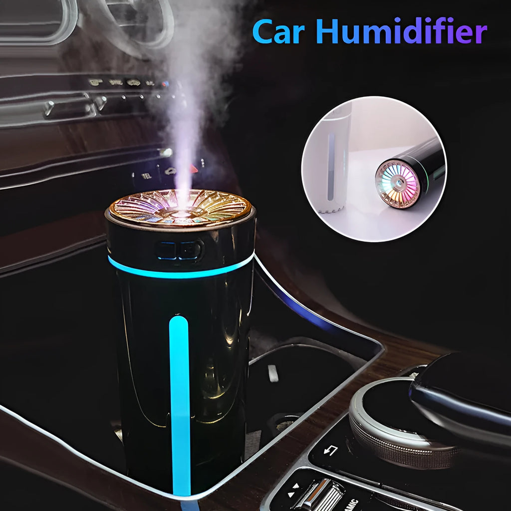 Black portable car humidifier with colourful LED lights on car cup holder showing mist output