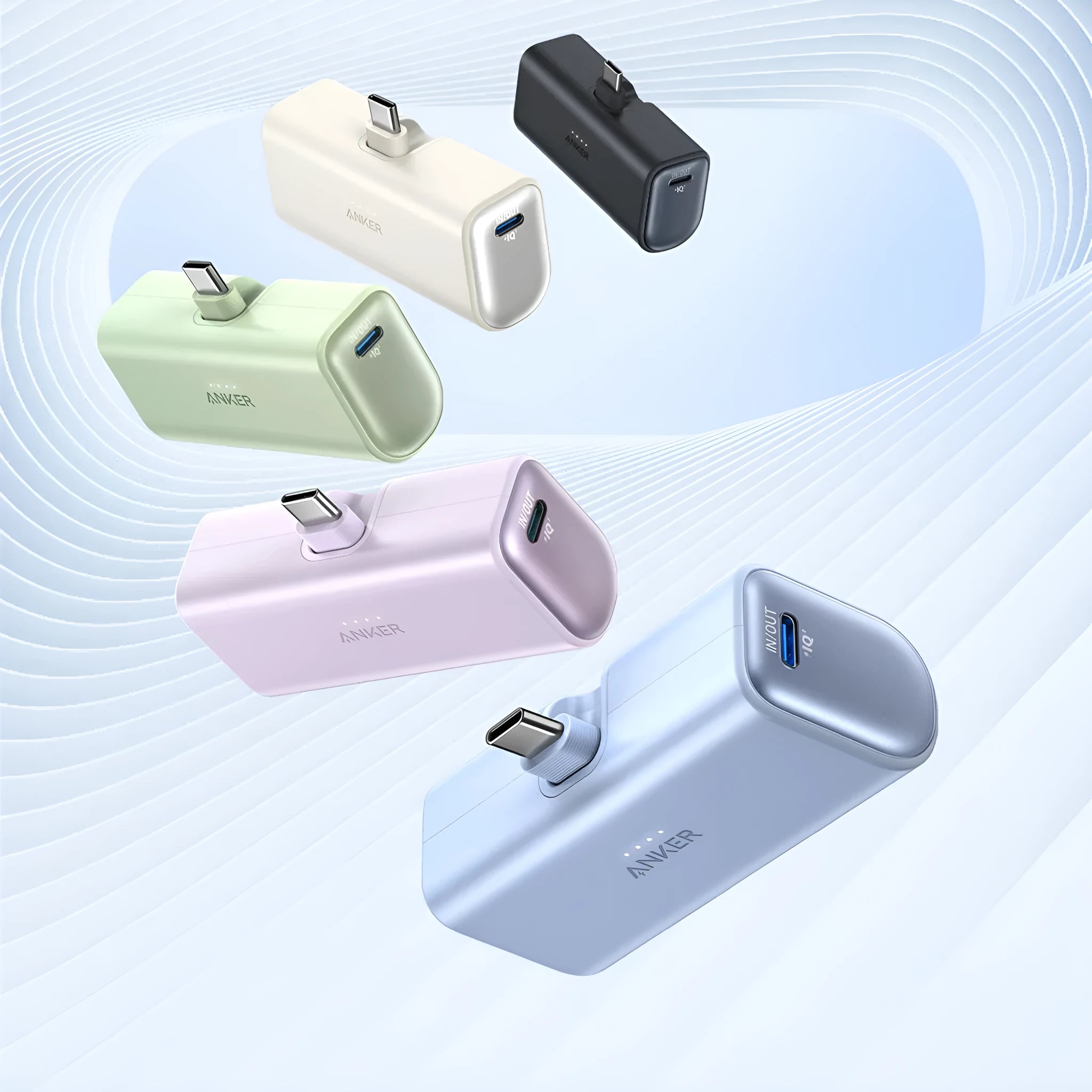 Small capsule-shaped power bank in multiple colours with a fold-out USB-C cable.