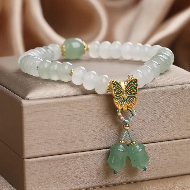 Green women's bracelet with Tian Shan Cui abacus beads and butterfly tassel