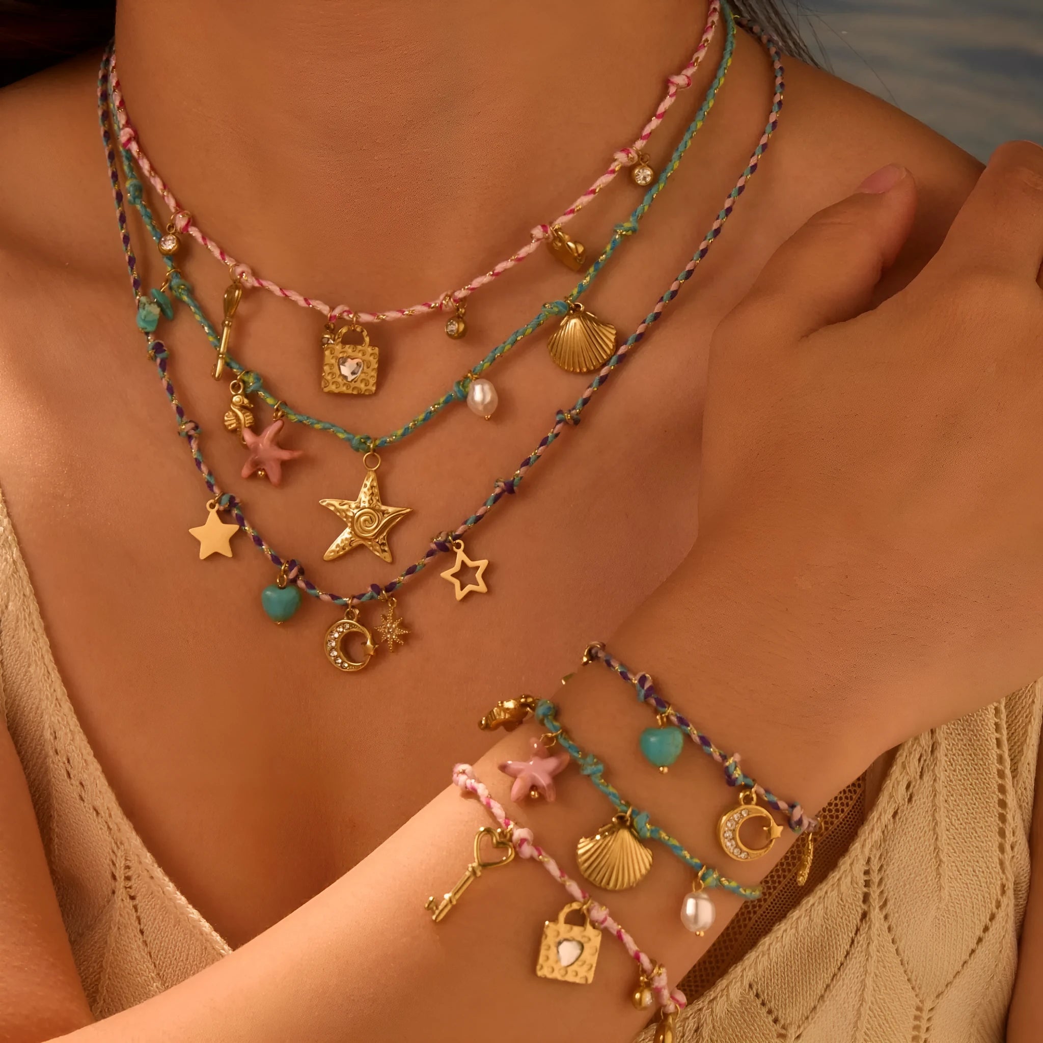 Close-up of a women's braided rope and titanium steel design necklace with a heart-shaped pendant on a stainless steel chain.
