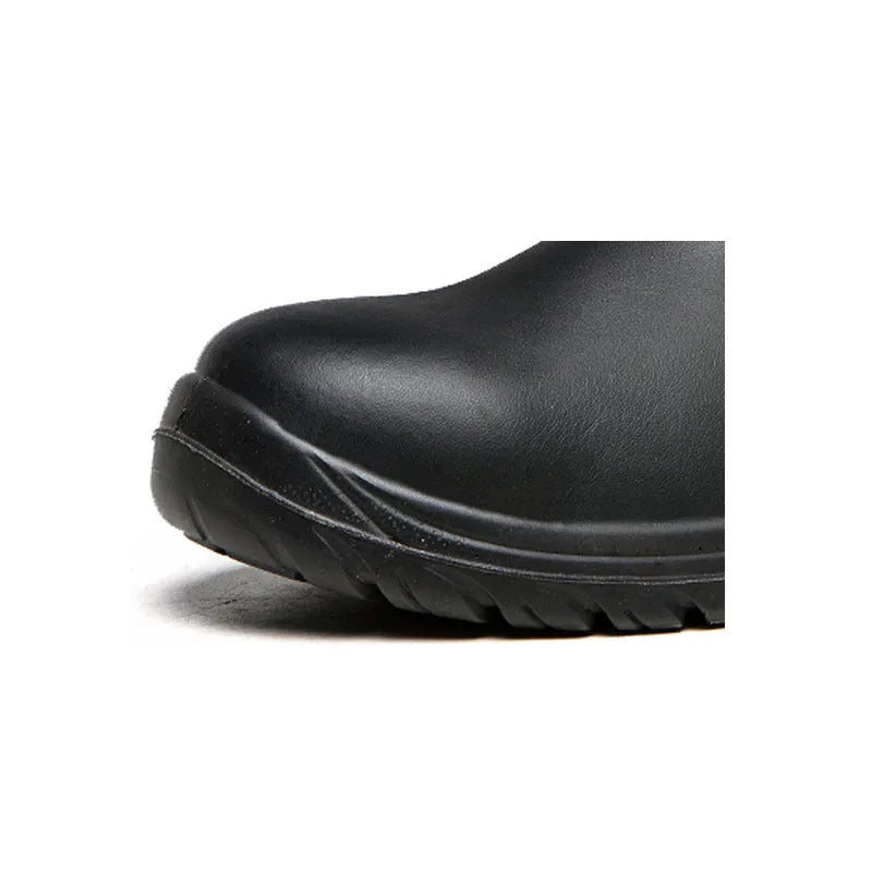 Black high-top leather safety work boots with anti-piercing sole on a grey industrial background