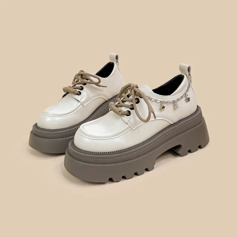 White women's platform Mary Jane shoes with chunky heel and front lace-up detail.