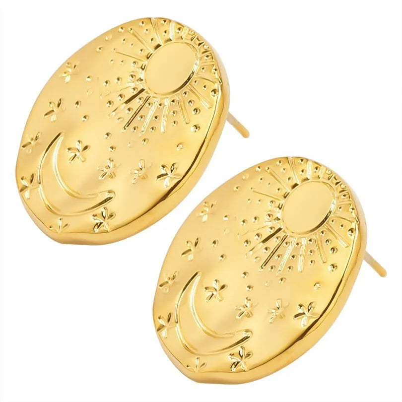 A pair of geometric stud earrings made from stainless steel with shell design details in gold colour finish.