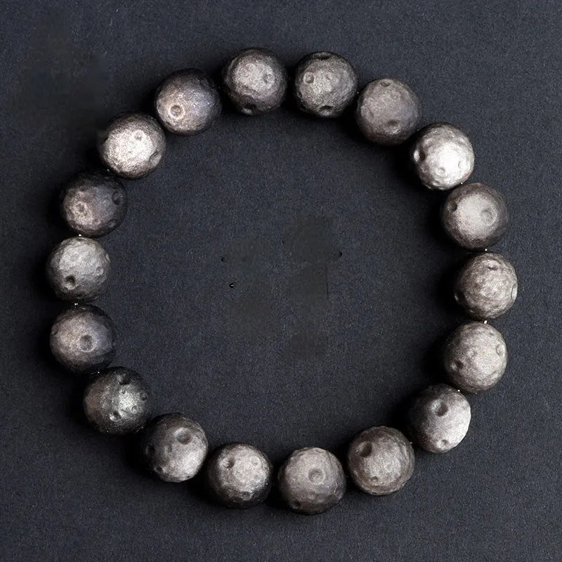 Obsidian crater ball bracelet with grinding texture in silver or gold meteorite finish
