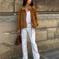Retro solid colour loose-fit long sleeve polyester jacket on a hanger.