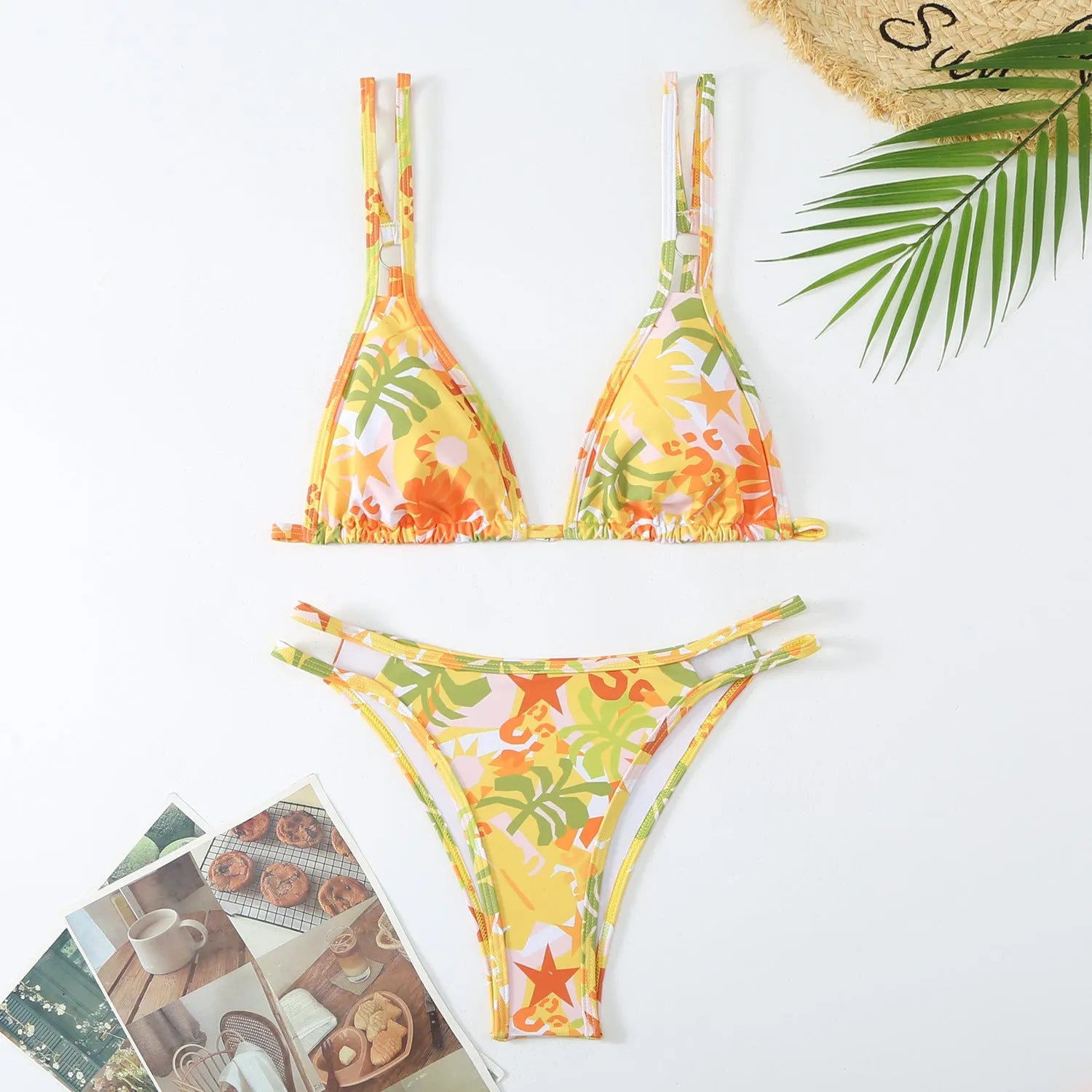 Women's printed halter top and briefs swimwear set in floral pattern for swimming.