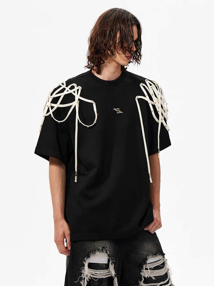 Black women's short-sleeve T-shirt with rivet ribbon detail on padded shoulder.