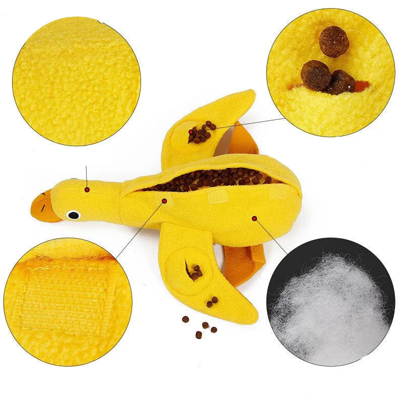 Yellow teddy dog toy with central duck doll, featuring a squeaker and treat leak compartment.