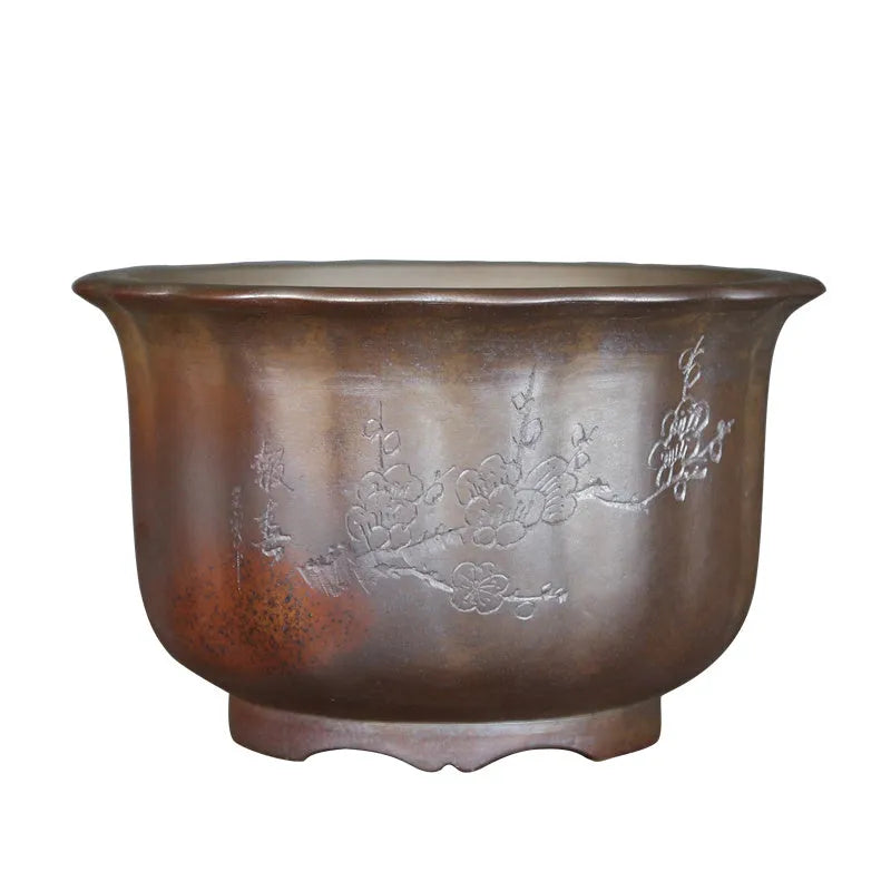 Antique carved ceramic flower pot with purple sand finish and wood burning texture