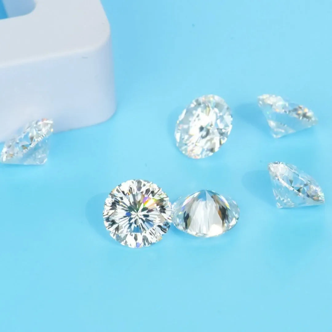 Round cut moissanite stone with eight hearts and eight arrows faceting, shown on a neutral background.