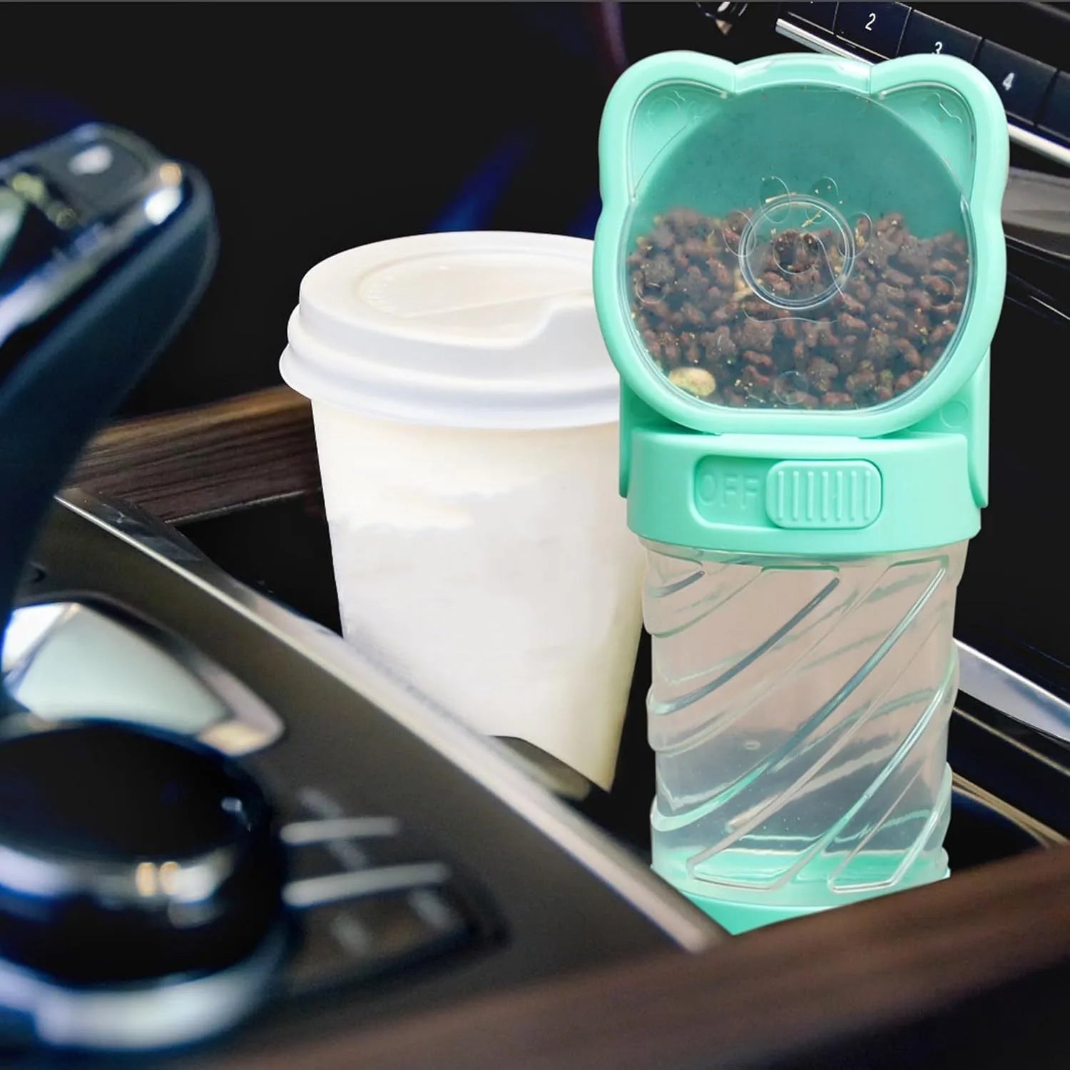 Green 3-in-1 pet water bottle with food container and waste bag dispenser for outdoor use