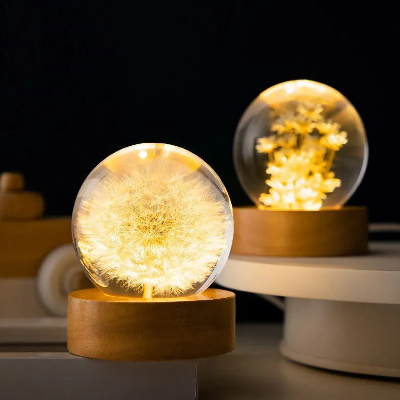 Luminous 3D dandelion crystal ball on a beech wood base, serving as a USB-powered desktop night light ornament.