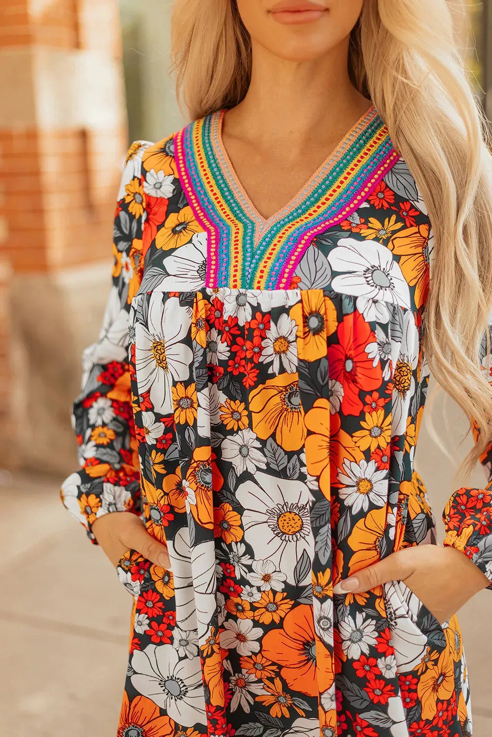 Orange floral striped lace V-neck long sleeve mini dress on hanger