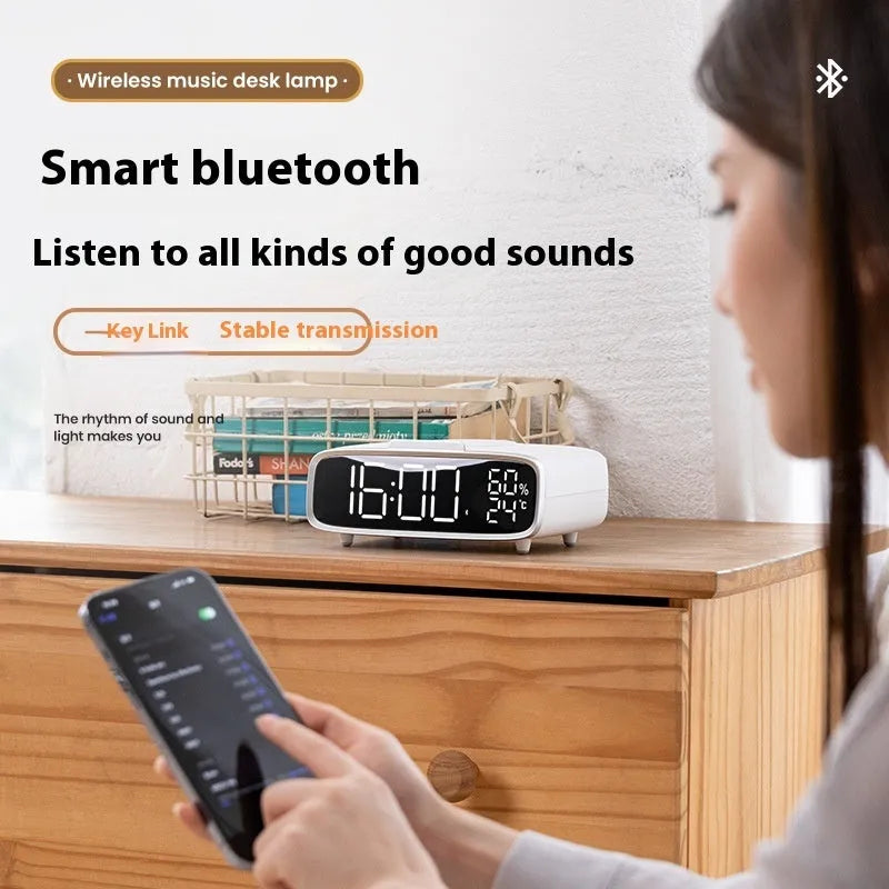 Compact white ABS acrylic 3-in-1 unit combining a Bluetooth speaker, wireless charger, and night light.