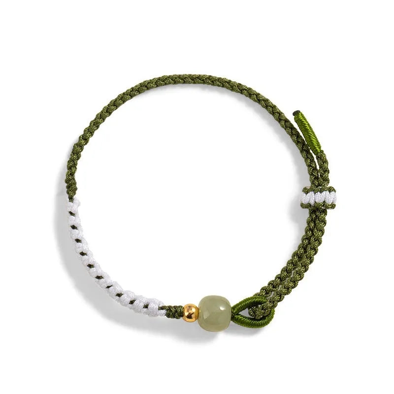 Women's Chinese national bracelet with Hetian jade charm on cord carrying strap