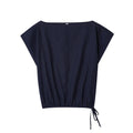 Women's beige linen-style co-ord set with flounced sleeve shirt and wide-leg trousers.