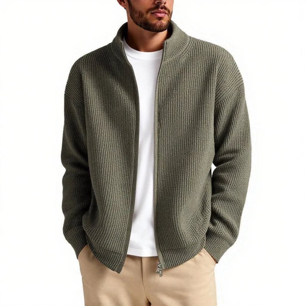 Man wearing a loose grey cardigan sweater with button-up front and V-neck.