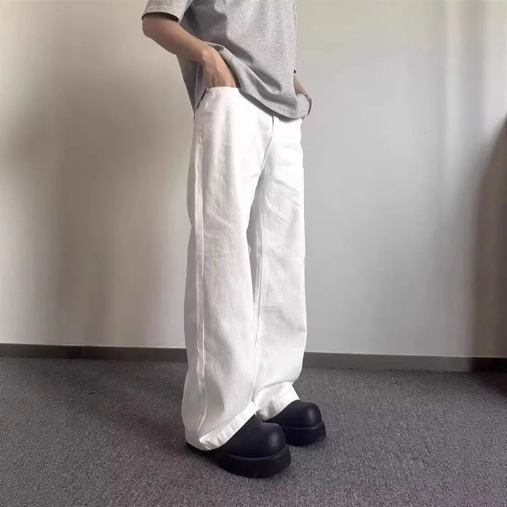 Men's white straight-leg jeans with loose fit and wide leg opening