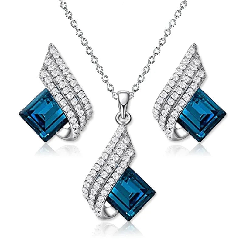 Women's alloy necklace and earring set with glass pendant featuring cross chain design