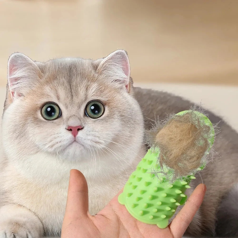 Silicone cat grooming comb with adjustable strap mounted on table leg, showing rounded teeth for pet hair removal
