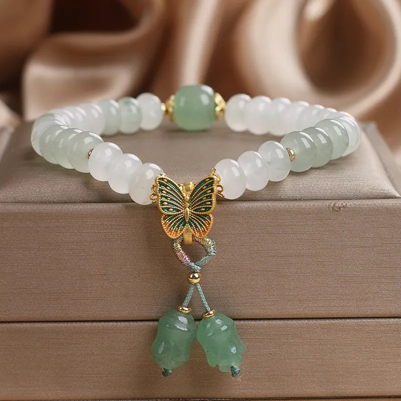 Green women's bracelet with Tian Shan Cui abacus beads and butterfly tassel