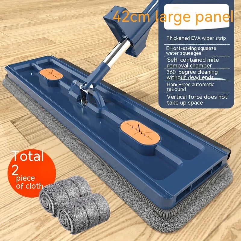 Large blue and white flat mop with a long stainless steel handle and a 360-degree rotating head on a hard floor.