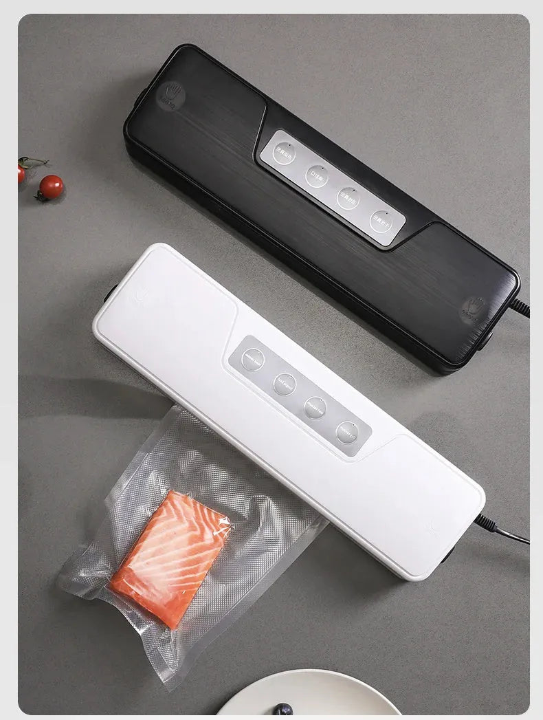 Black automatic vacuum sealer machine for household food preservation on kitchen counter