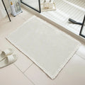 A checkered pattern polyester bathroom floor carpet showing non-slip backing.
