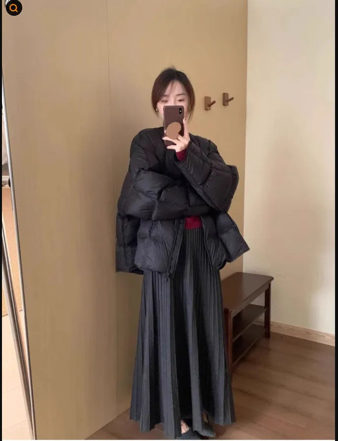 Dark grey knitted women's long dress suit with sweater, skirt, and 3D artistic pattern.