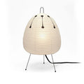 Japanese style table lamp with rice paper shade and aluminium base showing warm glow