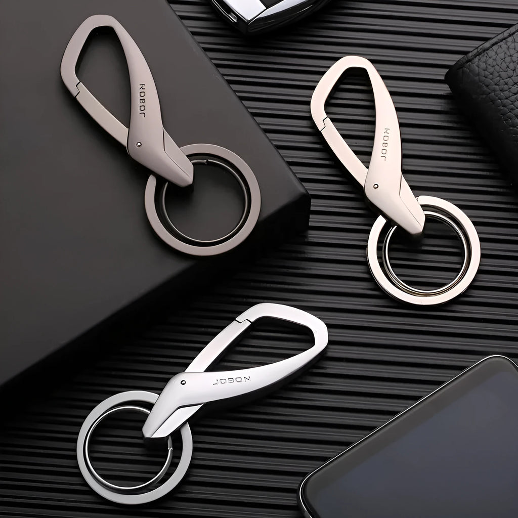 Modern zinc alloy double ring car keychain in black, chrome, and nickel colours showing its 8.3cm by 3.5cm size.