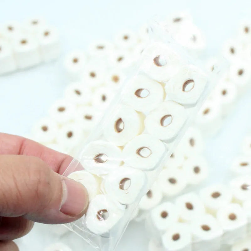 Miniature white paper tissue roll model for dollhouse display