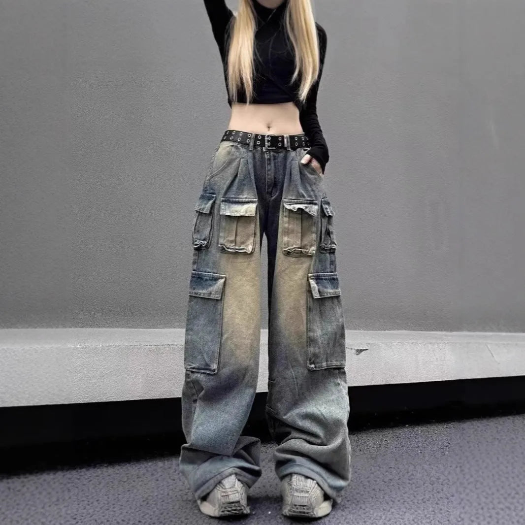 Man wearing light blue loose-fit distressed jeans with multiple pockets, showcasing street hipster style.