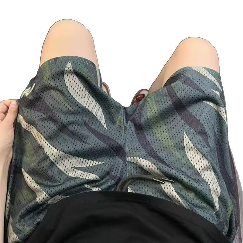 Men's straight-leg camouflage shorts in cotton blend fabric on a mannequin.