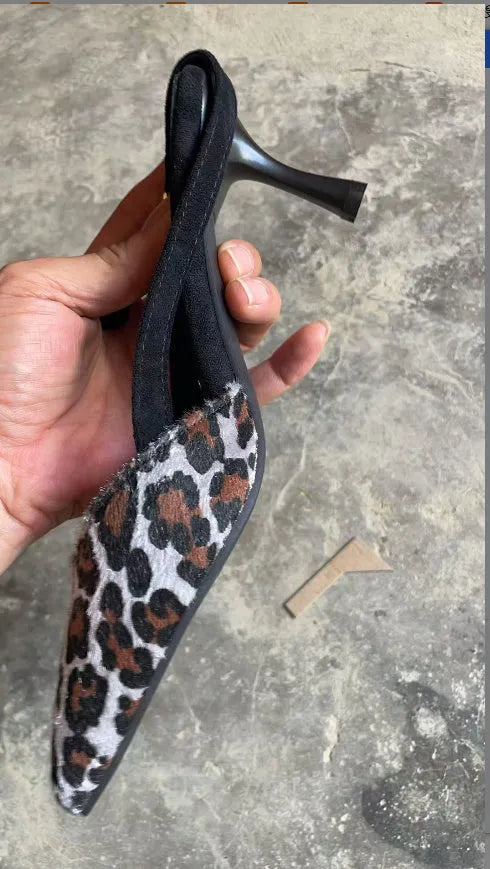 Scattered pointed toe women's sandals in leopard print suede, high heel style.