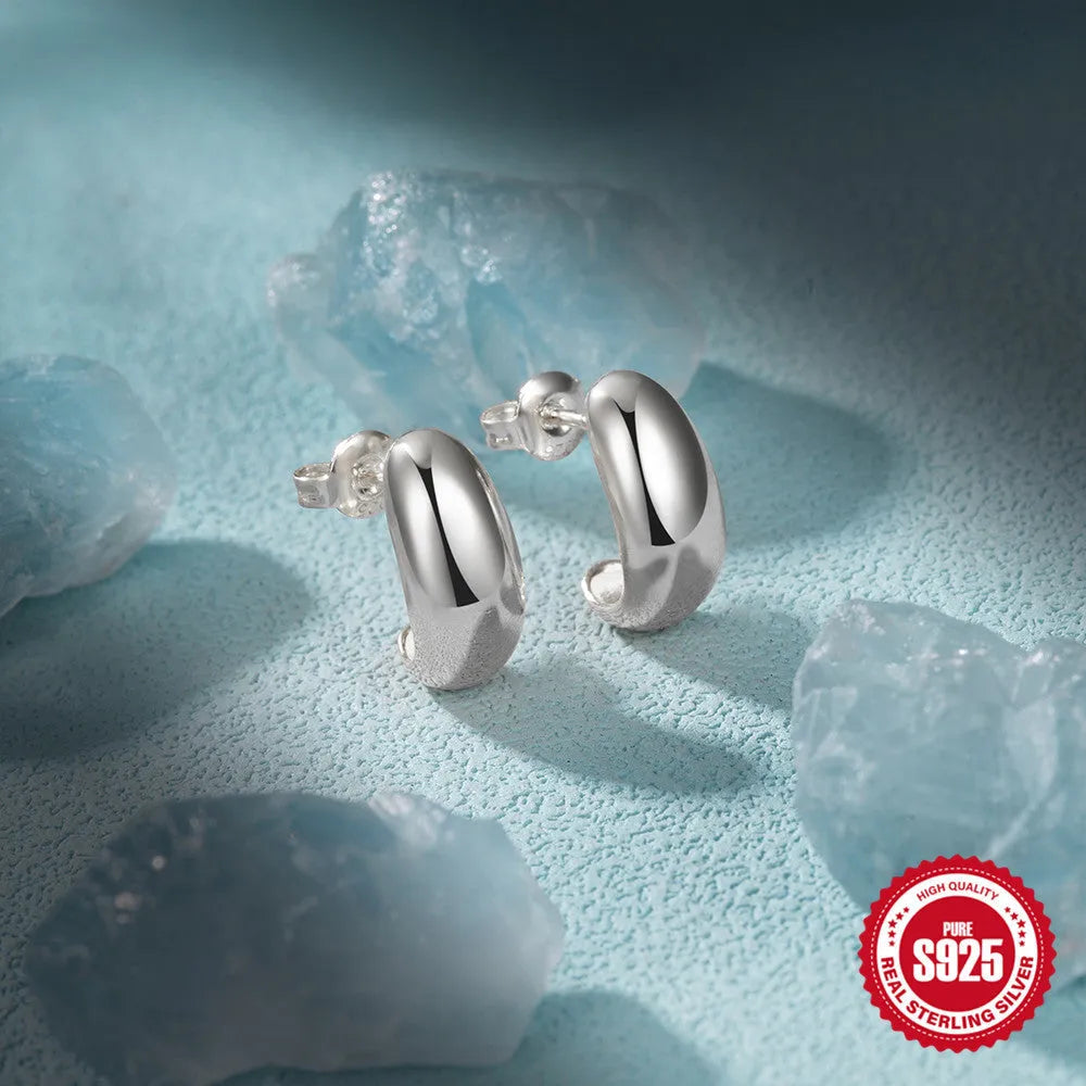 Sterling silver C-shaped stud earrings in electroplated gold or white gold finish