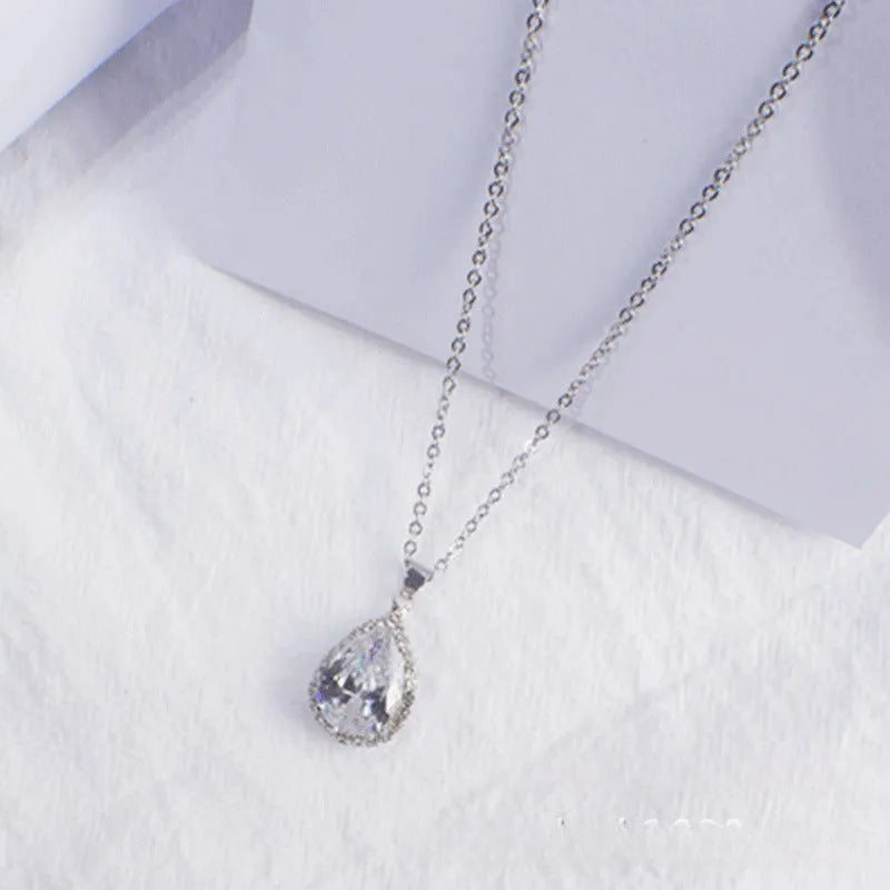 Women's rose gold electroplated rhinestone necklace with geometric water drop pendant in pink colour