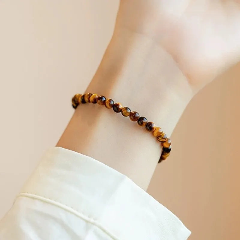 Tigereye stone geometric round bracelet in 4mm, 6mm, and 8mm bead size options.