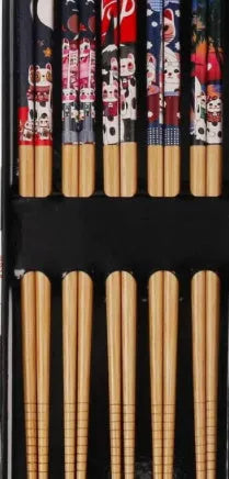 Five pairs of Japanese-style patterned bamboo chopsticks in lucky cat or elegant blue designs with cartoon patterns
