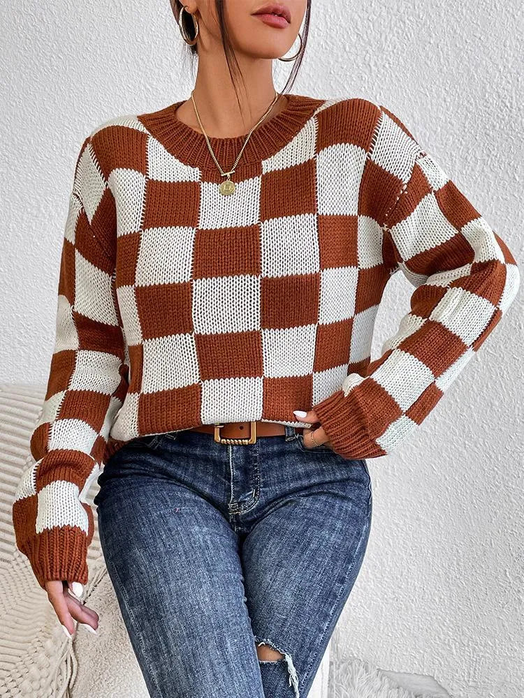Dark brown loose plaid pullover sweater with long sleeves and a round neck.