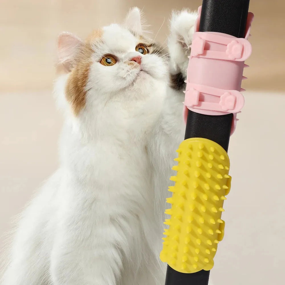Silicone cat grooming comb with adjustable strap mounted on table leg, showing rounded teeth for pet hair removal