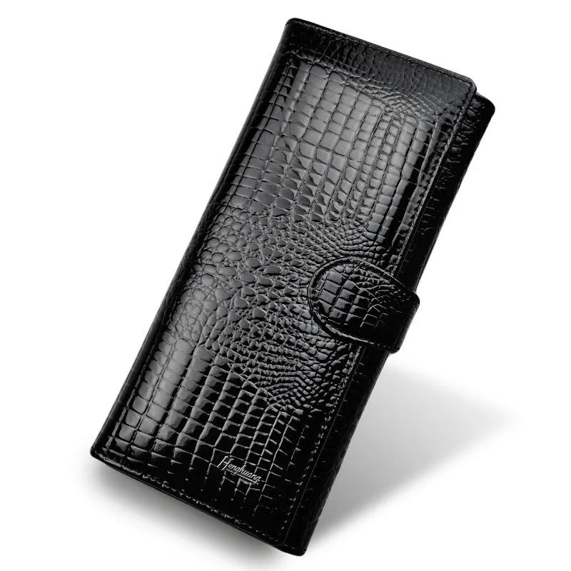 Women's patent leather coin purse with crocodile pattern in wine red colour showing pigskin lining