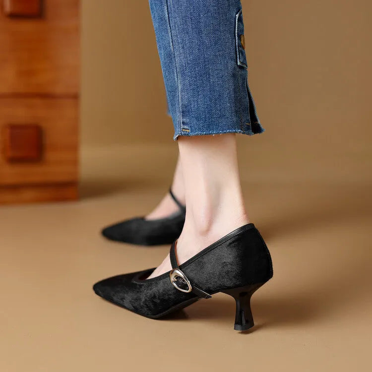 Women's black square toe stiletto heel ankle-strap shoes with horse hair upper on a neutral background.