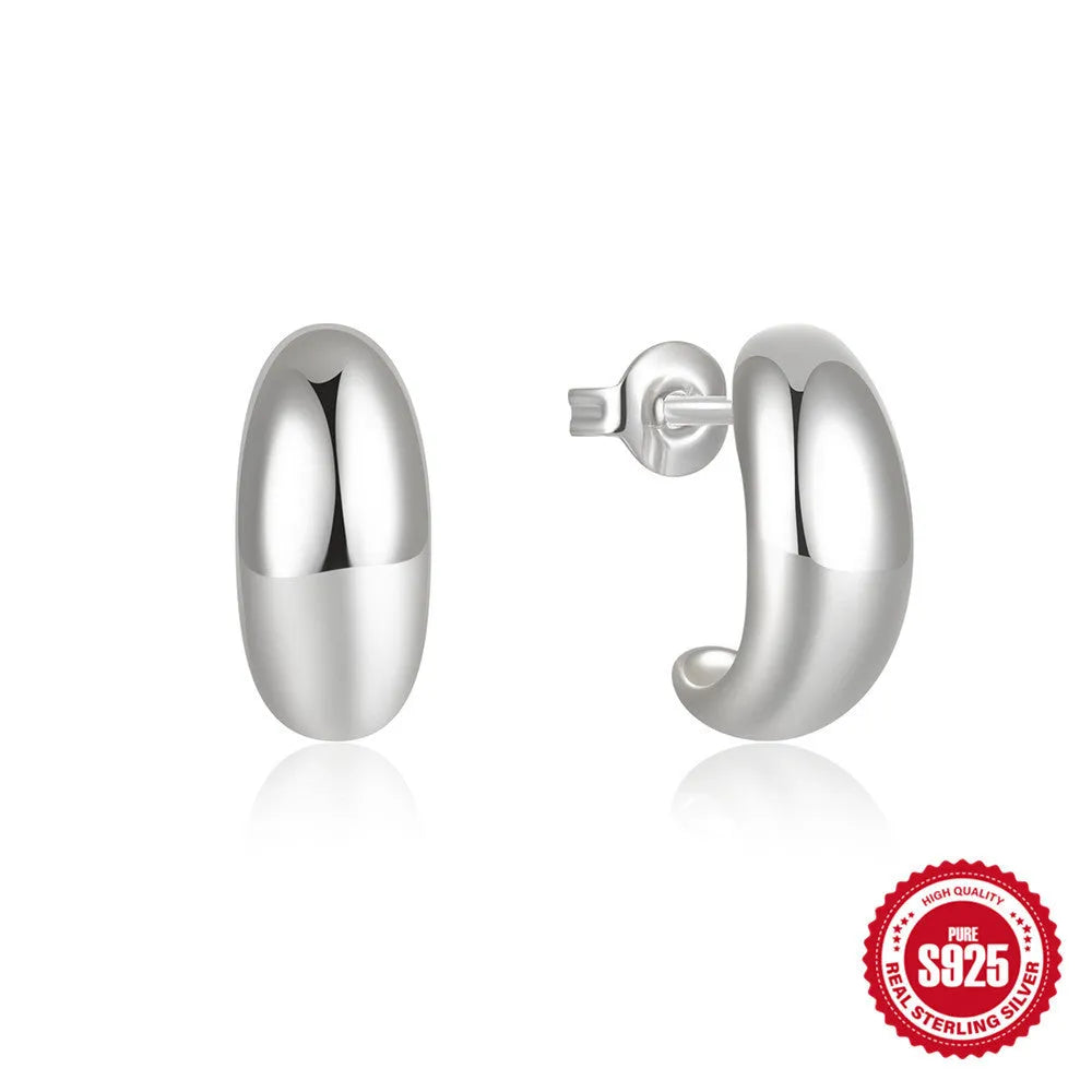 Sterling silver C-shaped stud earrings in electroplated gold or white gold finish