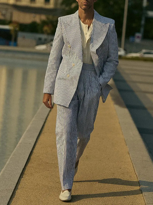 Blue and white striped men's suit set with polyester blazer and trousers on hanger